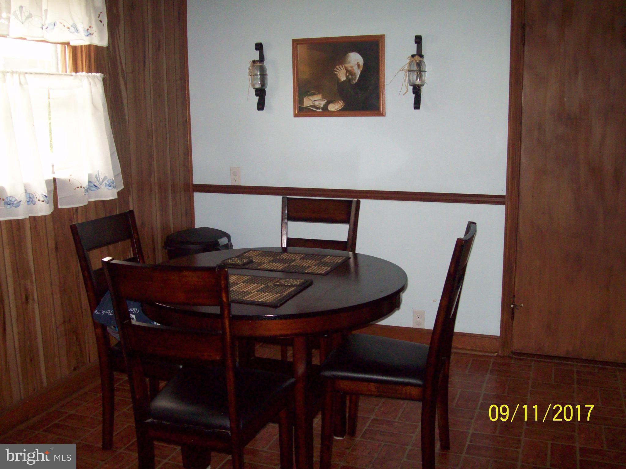12411 Big Spring Road Clear Spring, MD 21722 - Photo 9 of 17 a view of a dining room with furniture and window