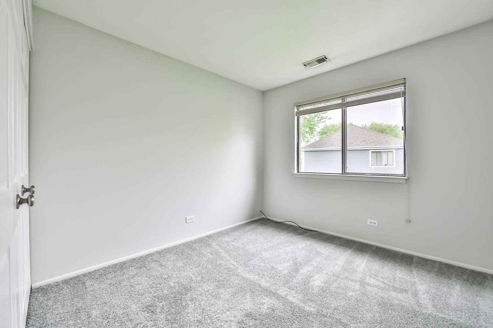1502 7 Pines Road, Unit D2 Schaumburg, IL 60193 - Photo 14 of 34 an empty room with windows