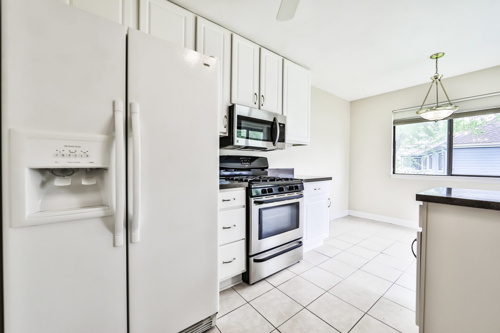 1502 7 Pines Road, Unit D2 Schaumburg, IL 60193 - Photo 26 of 34 a kitchen with stainless steel appliances a refrigerator and a stove top oven
