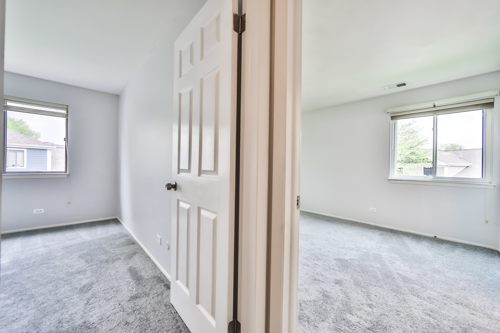 1502 7 Pines Road, Unit D2 Schaumburg, IL 60193 - Photo 4 of 34 an empty room with windows