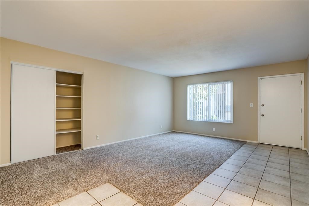 1219 Mitchell Street, Unit D Oceanside, CA 92054 - Photo 3 of 13 a view of an empty room with a window and fire place