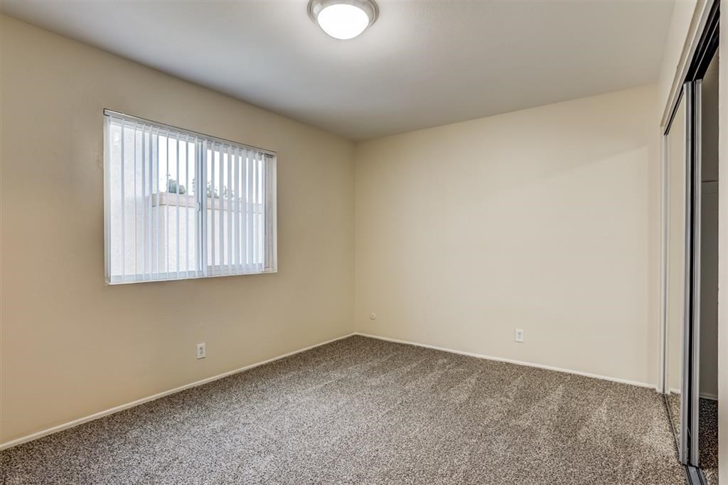 1219 Mitchell Street, Unit D Oceanside, CA 92054 - Photo 8 of 13 an empty room with windows