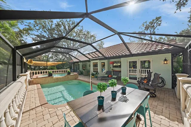 a view of a house with backyard outdoor seating and furniture