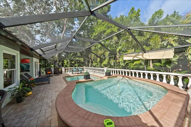a view of a swimming pool with a patio