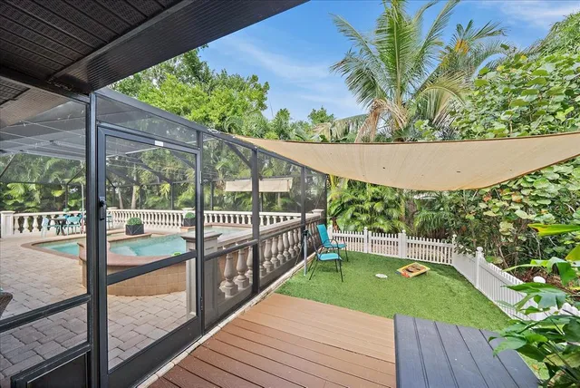 a view of balcony with wooden floor