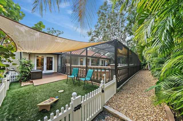 a view of house with a yard