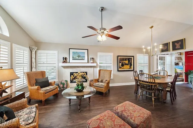 a living room with furniture wooden floor and a window