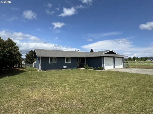 a house with yard in front of it