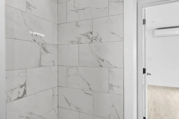 a spacious bedroom with a bed and a couch