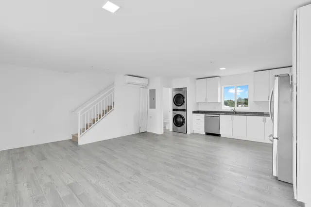 a kitchen with a stove top oven sink and cabinets