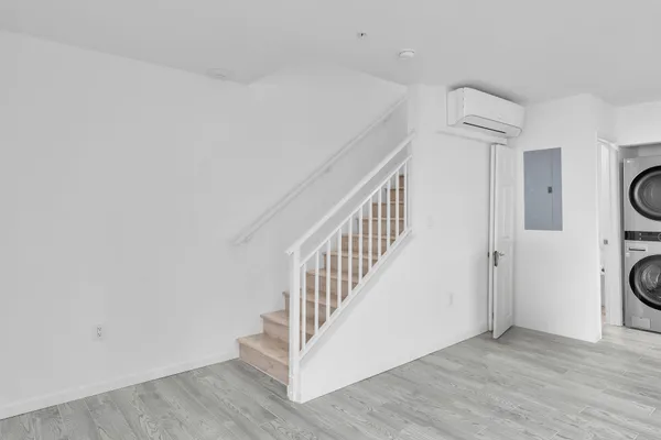 a view of multiple house with large windows and stairs