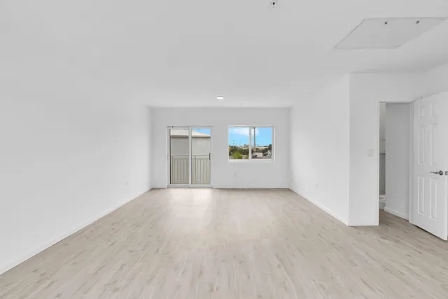 a view of an empty room with a window