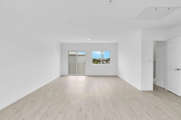 a view of a livingroom with furniture and windows