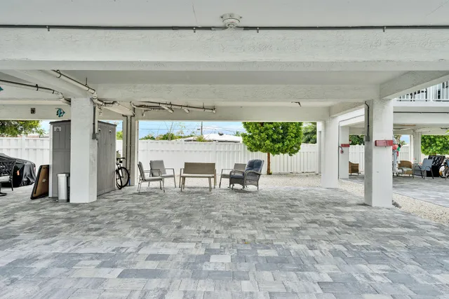 a view of a chairs and table in a patio