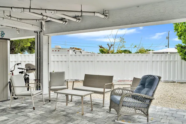 a outdoor living space with furniture and a potted plant