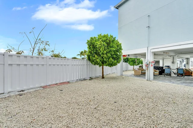 a view of a house with a slide and a child park