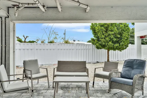 a view of swimming pool with outdoor seating