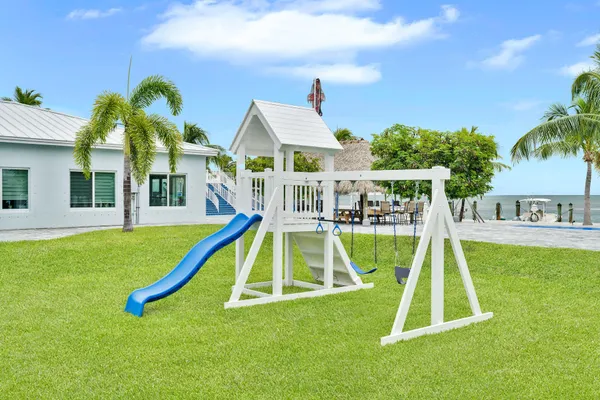 a view of swimming pool with outdoor seating