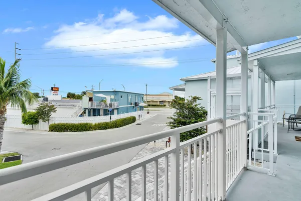 a view of a balcony with chairs