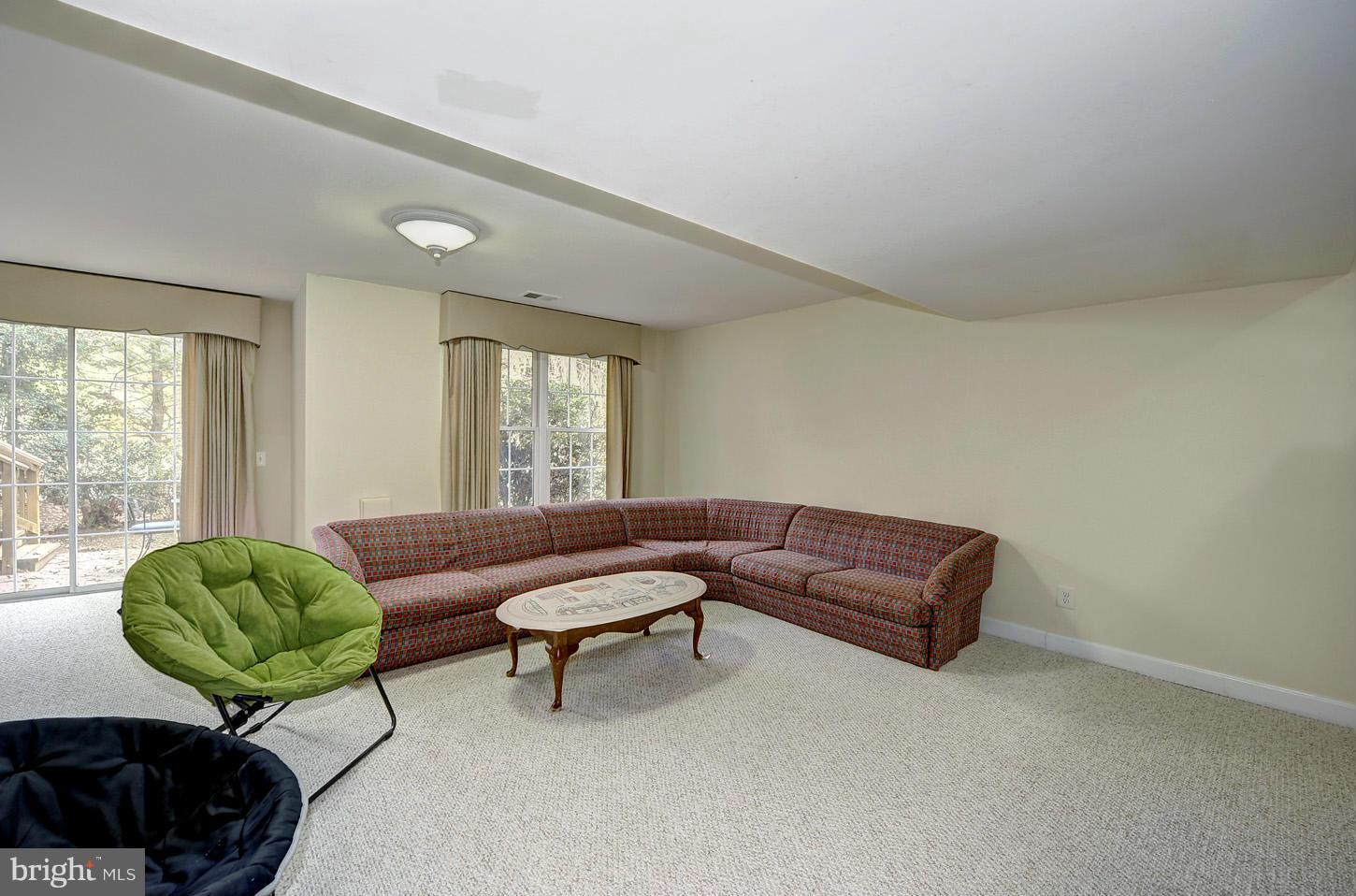9702 Hidden Valley Road Vienna, VA 22181 - Photo 22 of 30 Large rec room leads to patio