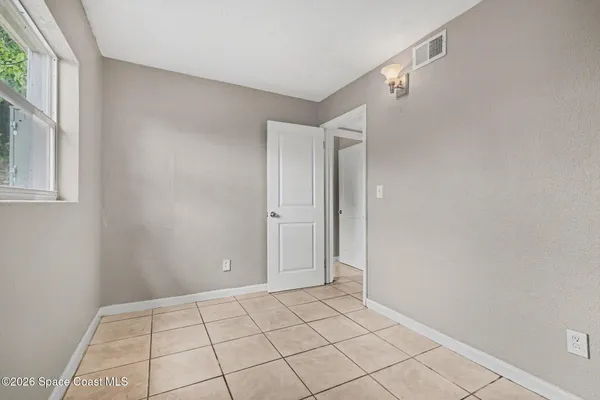 a view of an empty room and window