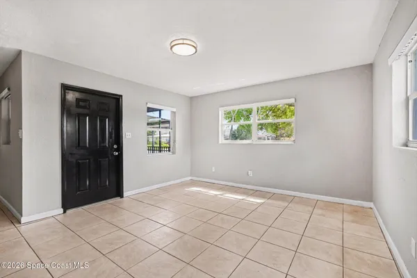 a view of an empty room and window