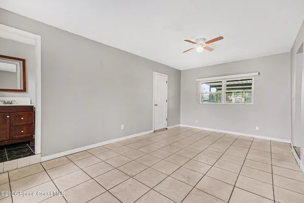 a view of an empty room and window