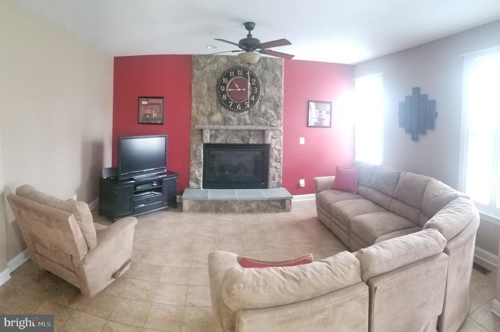 1215 Stallion Street Ranson, WV 25438 - Photo 4 of 10 Living Room w/ propane fireplace and stone mantel