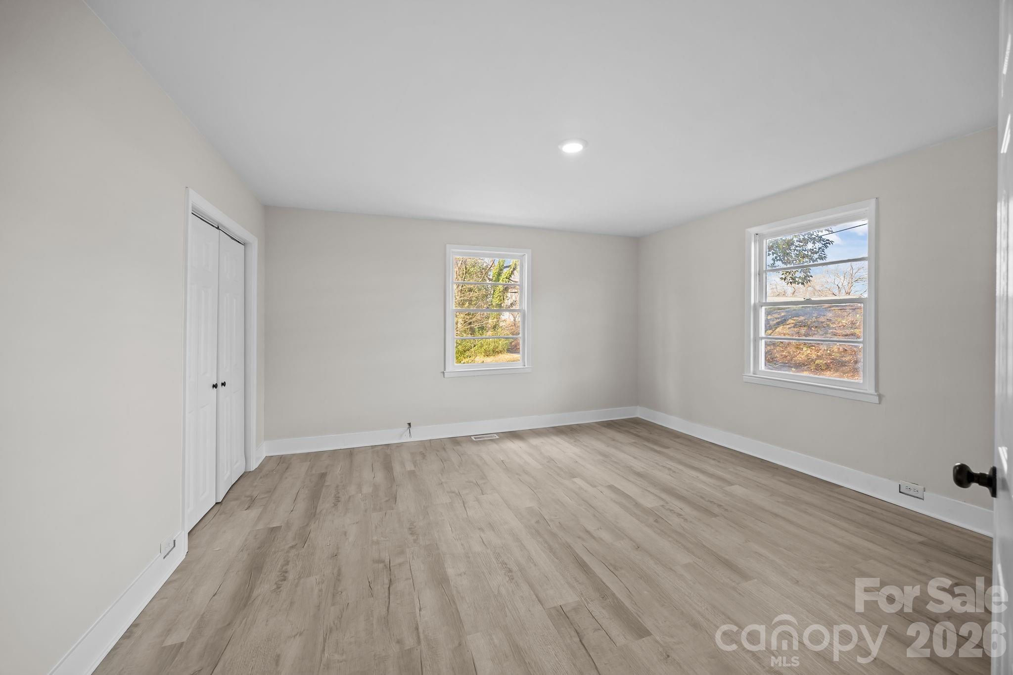 511 East Trade Street Dallas, NC 28034 - Photo 13 of 16 an empty room with windows