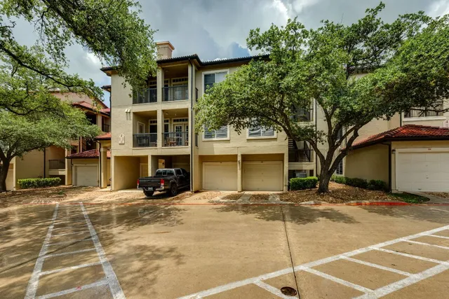 a view of a building with a tree