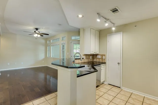 a view of a house with swimming pool and sitting area
