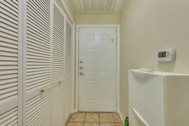 a view of room with a ceiling fan and window