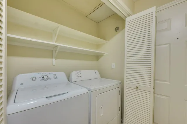 an empty room with a ceiling fan and entryway