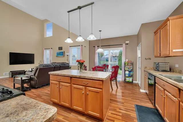 a kitchen with granite countertop a sink and a window