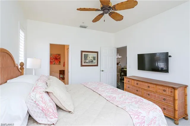 a bathroom with a sink mirror vanity and toilet