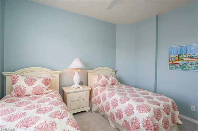 a bathroom with a sink a toilet and shower curtain