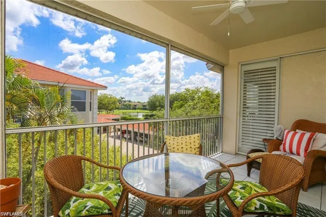 a view of a chair and tables in the balcony