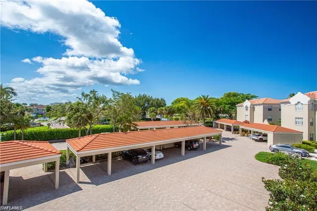 a view of a car park in front of house