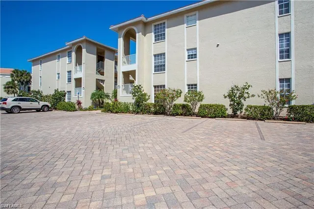 a view of a patio with swimming pool