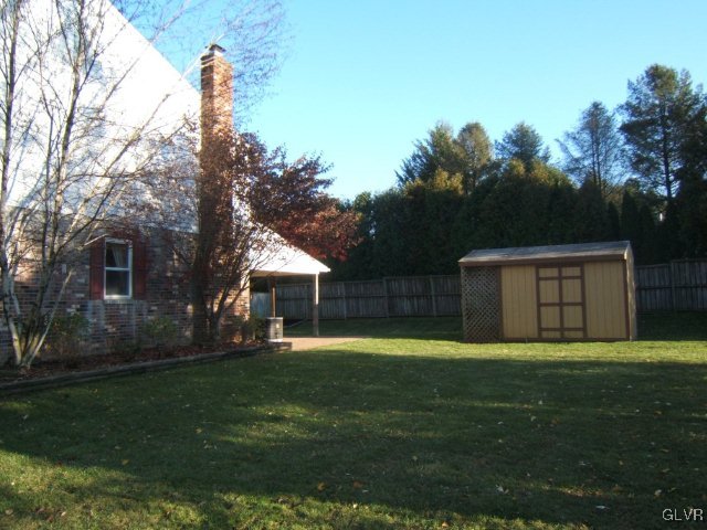 7616 Buttercup Road Lower Macungie Township, PA 18062 - Photo 5 of 11 a swimming pool with wooden fence