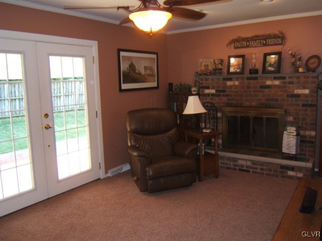 7616 Buttercup Road Lower Macungie Township, PA 18062 - Photo 6 of 11 a living room with furniture and a fireplace