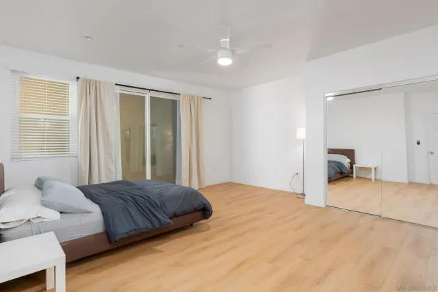 a bedroom with a bed and a couch