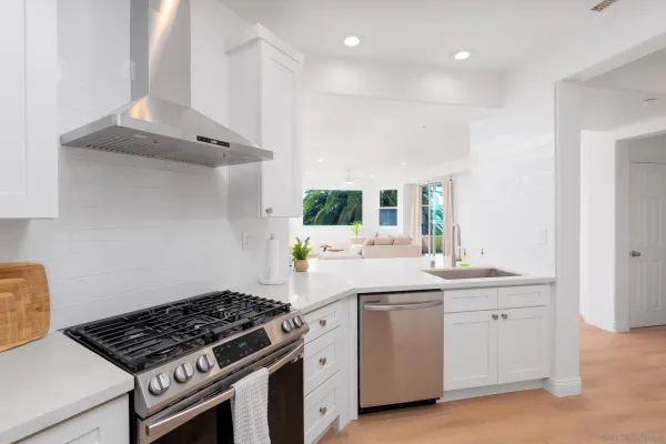 a kitchen with a stove and a sink