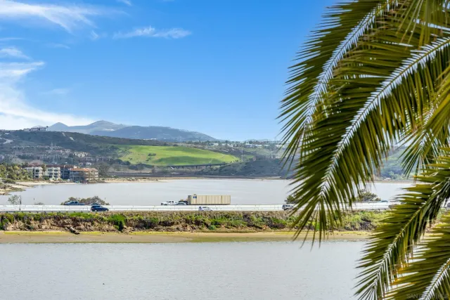 a view of a swimming pool and chairs