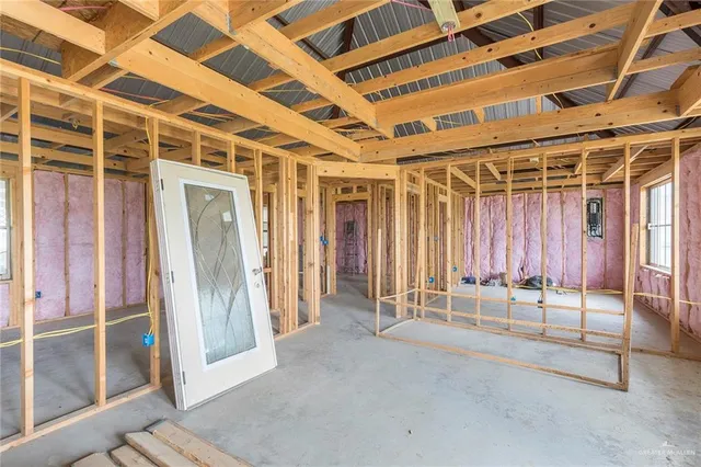 a view of an empty room with wooden walls