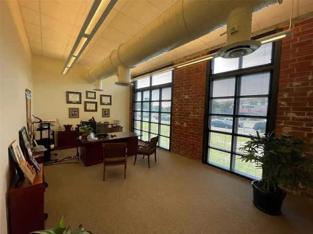 a work room with furniture and windows