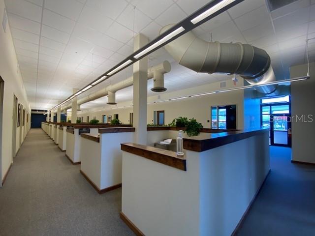 1925 East 2nd Avenue Tampa, FL 33605 - Photo 9 of 17 a kitchen with a sink a counter and chairs