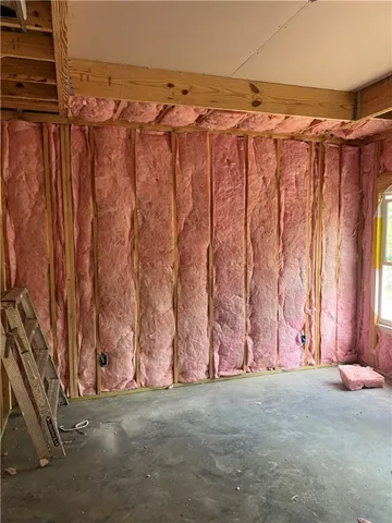 a view of a room with stairs and a wooden floor