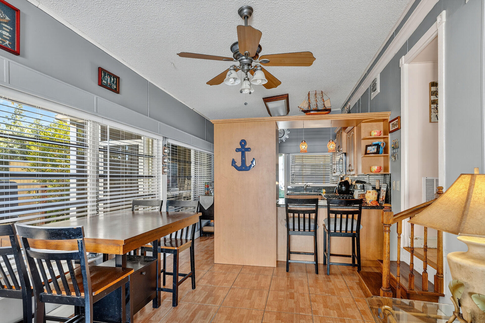 65821 Overseas Highway, Unit 112 Long Key, FL 33001 - Photo 18 of 49 a view of a dining room with furniture window and wooden floor