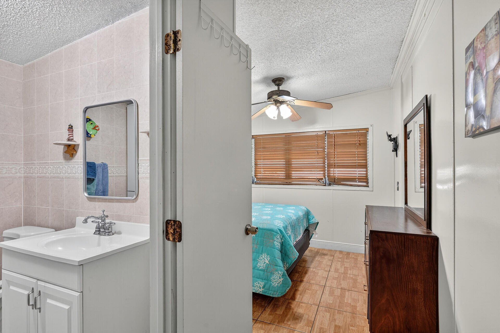 65821 Overseas Highway, Unit 112 Long Key, FL 33001 - Photo 19 of 49 a bathroom with a sink and a mirror
